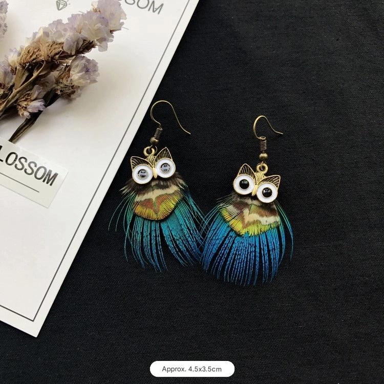 Vintage owl feather earrings close-up