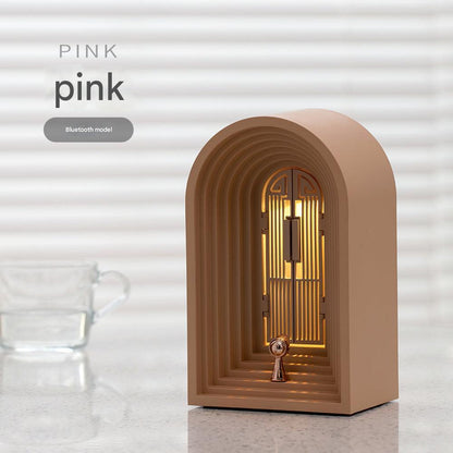 sleek bedside lamp with integrated speaker