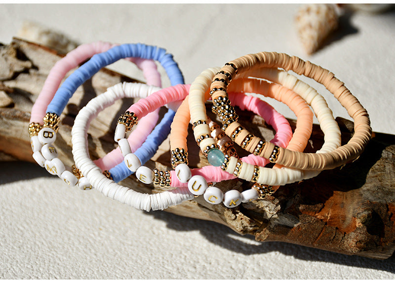 Close-up of colorful geometric charm bracelet - image 2
