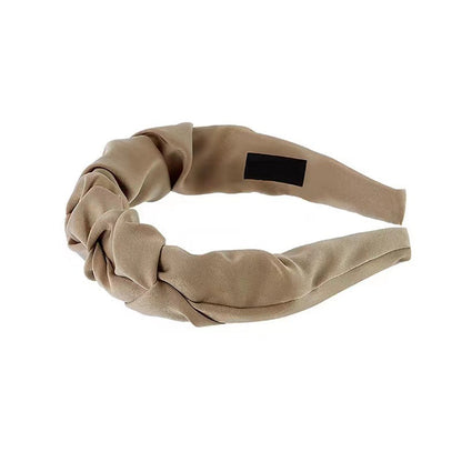 Stylish wrinkled wide hairband fabric close-up