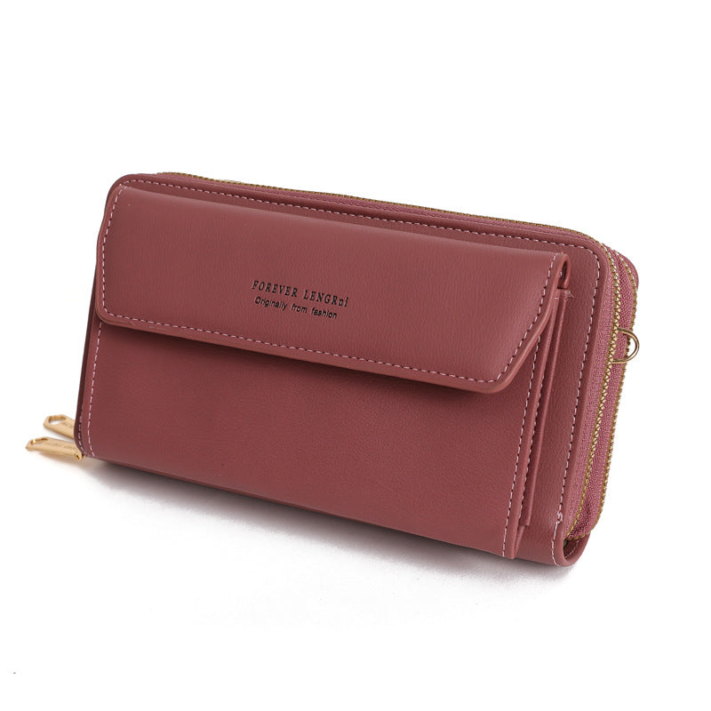 Black compact handbag featuring zipper closure