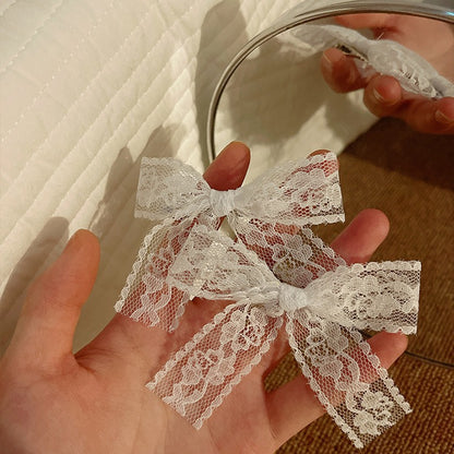 Blue bow hair clip styled on child's hair