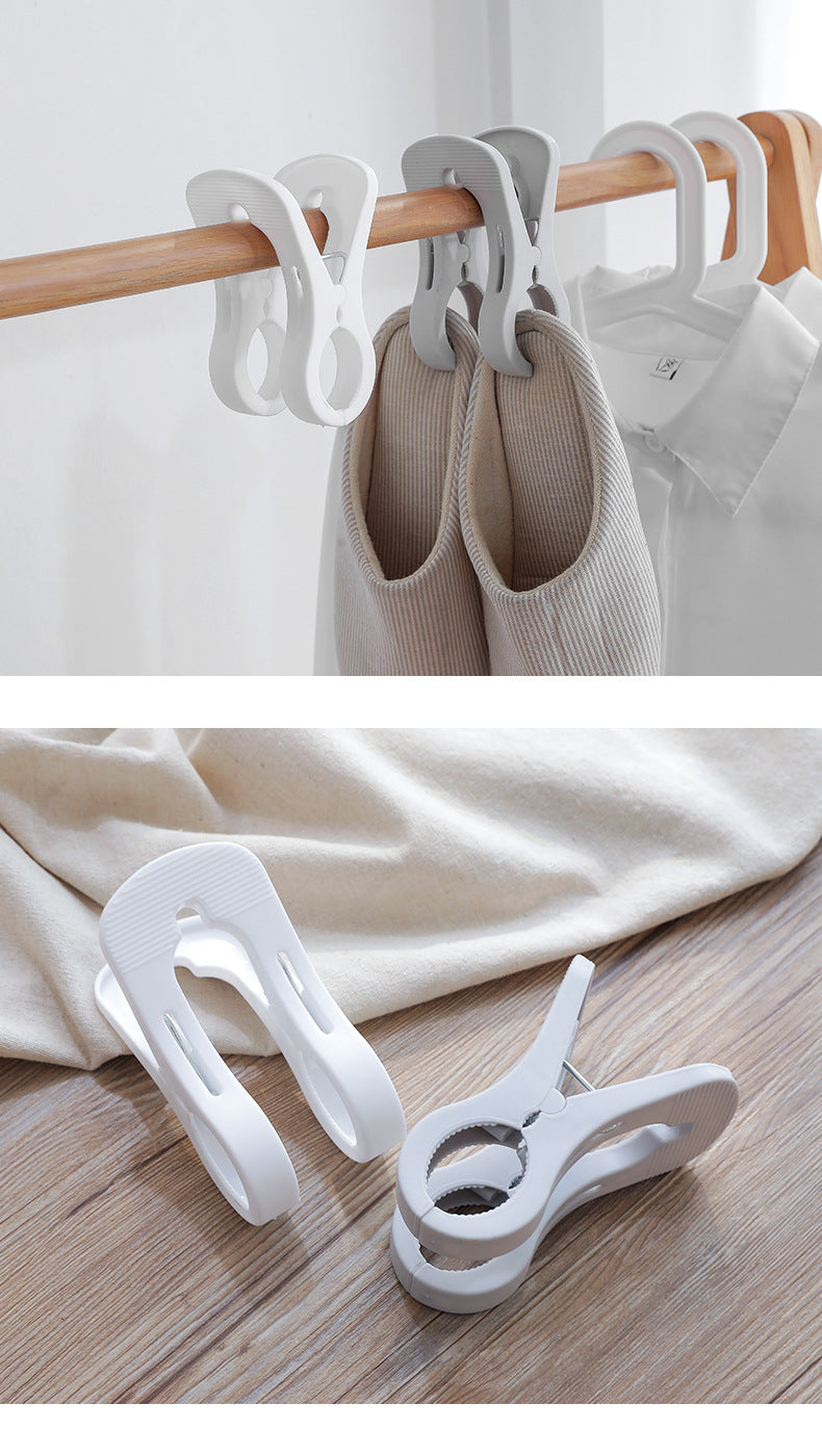 Durable plastic clothespins in use
