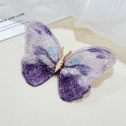 Colorful butterfly brooch on display