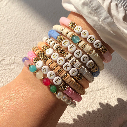 Colorful charm bracelet worn by a model outdoors - image 5