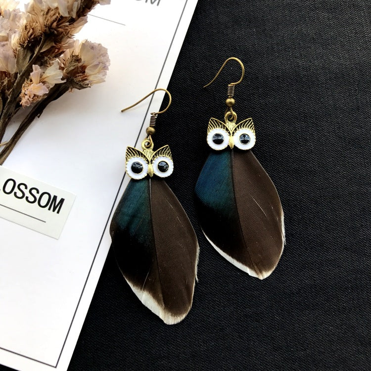 Vintage owl feather earrings close-up